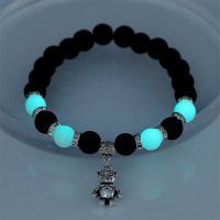 Armband Lavastein Schwarz mit blau leuchtenden Steinen...